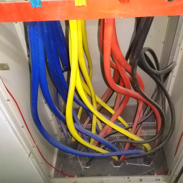 Electrical power cables inside a control panel requiring fire detection and suppression protection